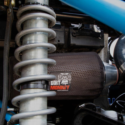 Close-up of Dirt Monkey Can Am X3 performance air filter kit featuring a high-flow air filter designed for enhanced engine performance. Kit includes durable components for optimal filtration and improved airflow, boosting vehicle power and efficiency. 
