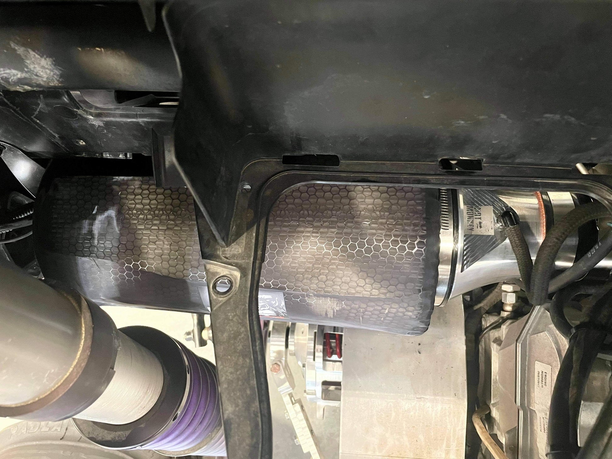 Close-up of Dirt Monkey Can Am X3 performance air filter kit featuring a high-flow air filter designed for enhanced engine performance. Kit includes durable components for optimal filtration and improved airflow, boosting vehicle power and efficiency. 