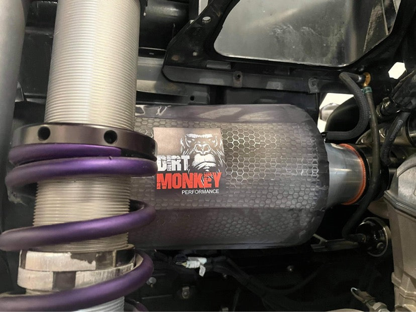 Close-up of Dirt Monkey Can Am X3 performance air filter kit featuring a high-flow air filter designed for enhanced engine performance. Kit includes durable components for optimal filtration and improved airflow, boosting vehicle power and efficiency. 